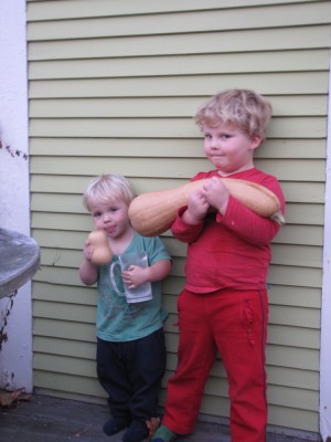 Harvey and Zion posing holding squashes