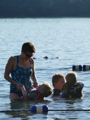 Mama playing with the boys in the water