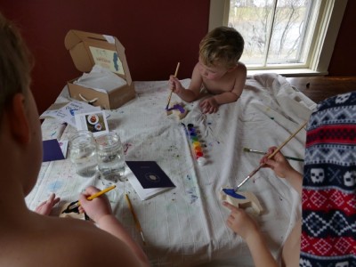 the kids painting at the table