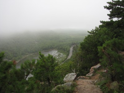 a view of The Tarn through the fog from the lower slopes of Champlain