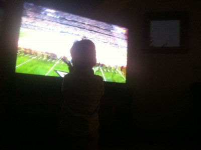 Lijah watching an enormous television