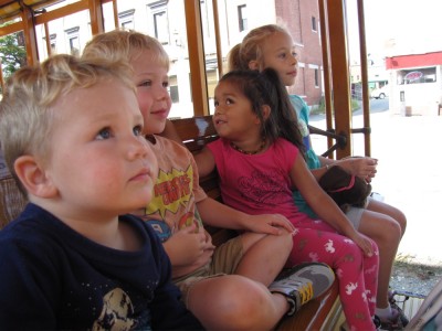 the kids riding the real trolley