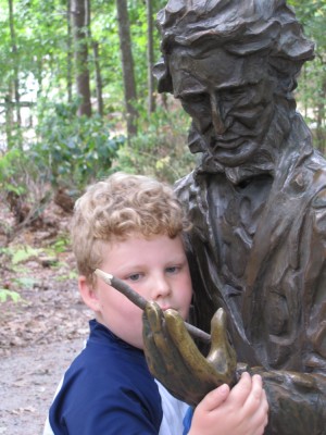 Harvey with the Thoreau statue, the pencil in Henry's hand
