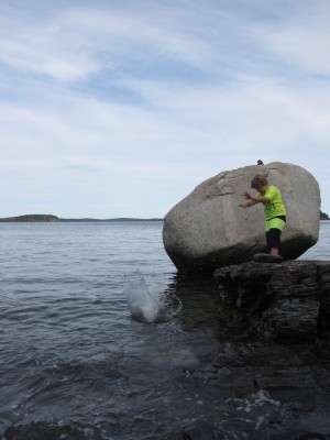 Harvey throwing a big rock into the ocean, making a big splash