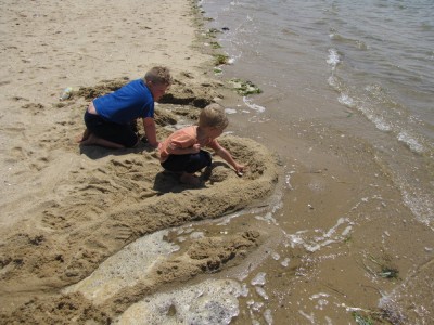 Harvey and Zion working on a sandcastle