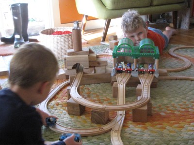 Lijah and Harvey building a train track