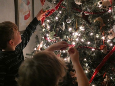 the boys decorating the tree