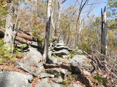 the boys resting on a rock on the way up Mt Wachusett