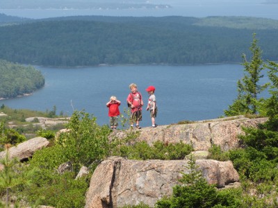 the three boys on a distant outcropping, Eagle Lake behind them