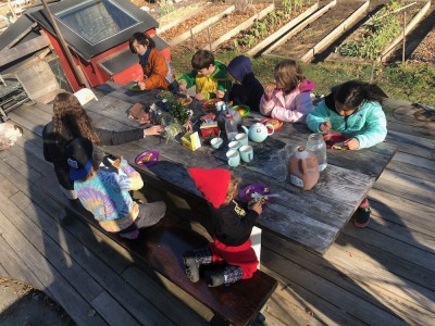 kids eating at the picnic table on our back deck