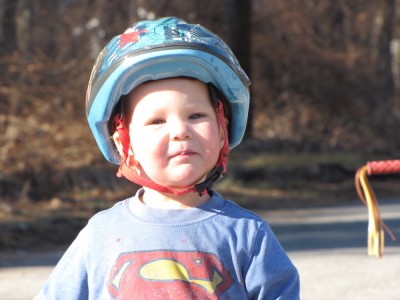 Lijah out on the street in bike helmet and t-shirt