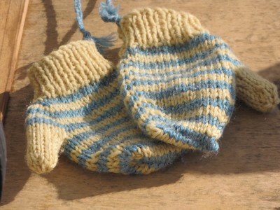 close-up of the yellow and blue striped mittens