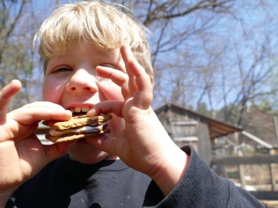 Zion about to take a bite out of a perfectly made smore