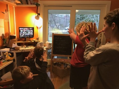 our family dancing in the playroom to a folk-dance caller on the computer