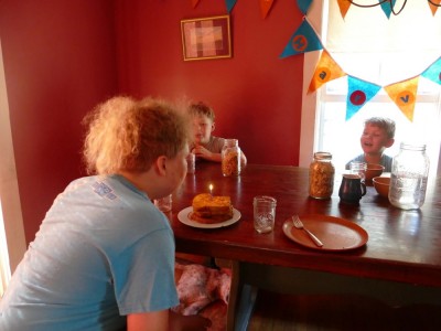 Harvey blowing out the candle on his birthday breakfast french toast