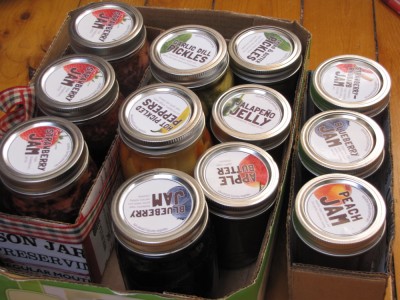 several jars of jam, jelly, and pickles