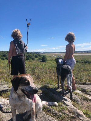 Zion with a stick, Elijah, and the dogs atop the airport hill