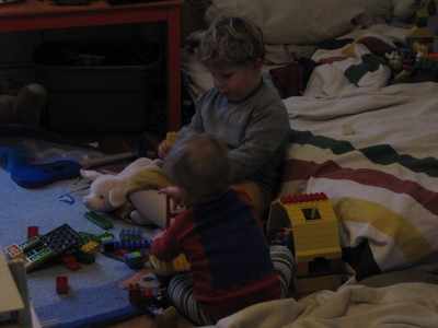Harvey and Zion playing with legos in their room