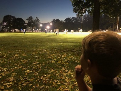 Elijah watching the Bedford football band practice under the lights