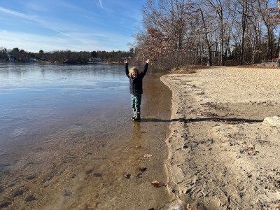 Elijah standing on very thin ice at the edge of Freeman Lake