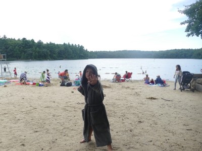 Elijah posing on the pond beach in his new bathrobe