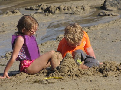Taya and Harvey playing in the sand