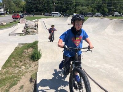 Zion and Elijah riding in the bike park