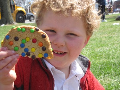 Harvey holding half of a big cookie