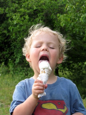 Zion licking a vanilla ice cream cone