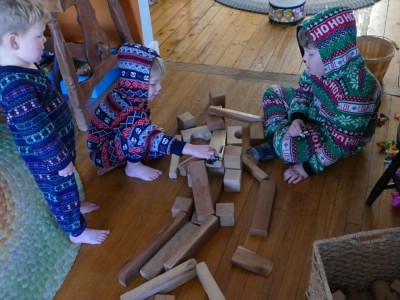 the boys in pjs playing with blocks