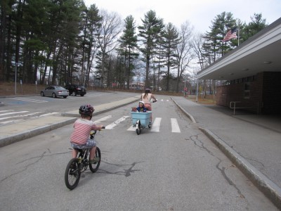 Harvey and Mama (w/ Zion) biking by the middle school