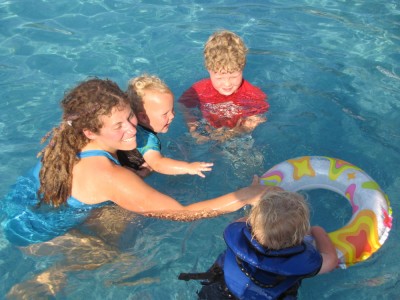 Mama and the boys playing in the pool