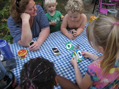 Zion and Harvey playing Uno with friends (and friend's mom) at the picnic table