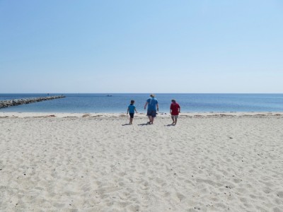the boys walking towards the calm beach