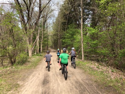 the boys and friends riding on the dirt bike path