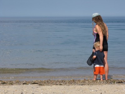 Leah and Lijah at the edge of the ocean, looking out to sea