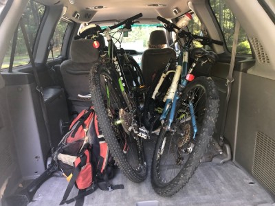 two bikes in the trunk of the van
