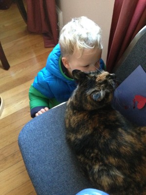 Lijah kissing a cat