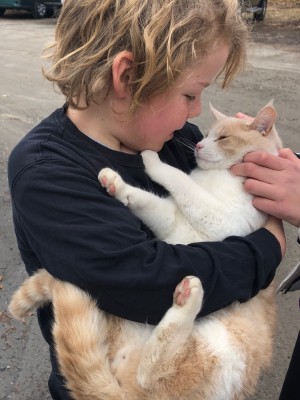 Zion holding a cat
