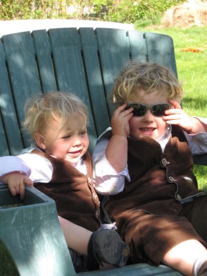 Zion and Harvey relaxing in a shared Adirondack chair