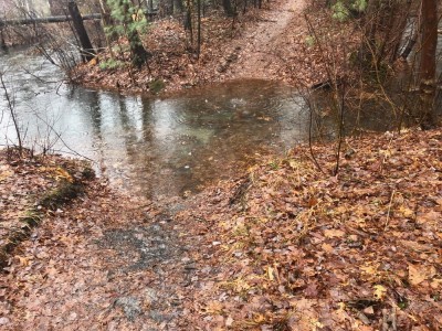 a flooded out path, with no snow to be seen