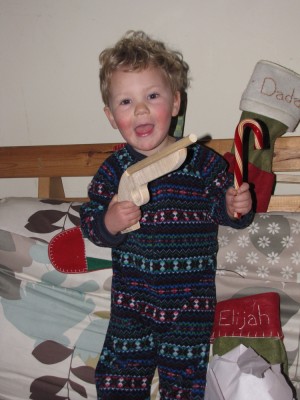 Lijah smiling with his gun and candy cane