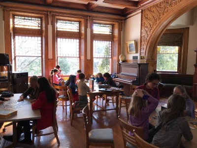 homeschoolers playing board games in an elegant room at the Lincoln Public Library