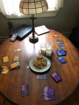 cookies and milk and Dungeon Mayhem on the coffee table