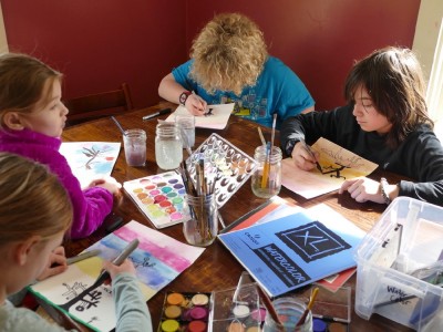 kids doing art at our kitchen table