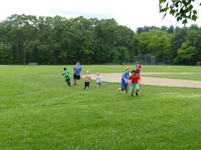 the boys of the homeschool coop playing in the field