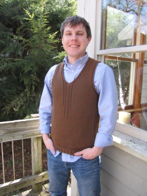 Dan in a brown sweater vest that leah knit
