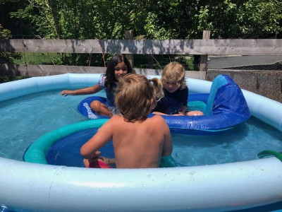Zion, Elijah, and a friend in the little pool on our deck