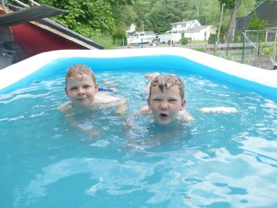 Zion and Elijah swimming in the pool on our deck