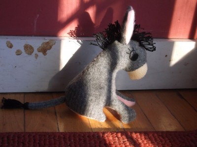 stuffed donkey in a sunbeam